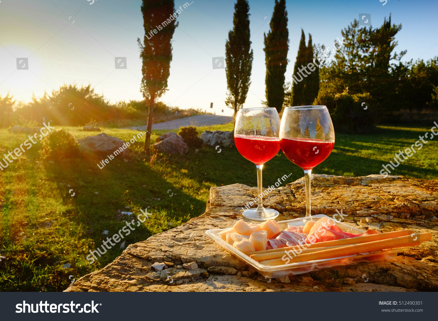 Landscape of Tuscany and two glasses of wine  