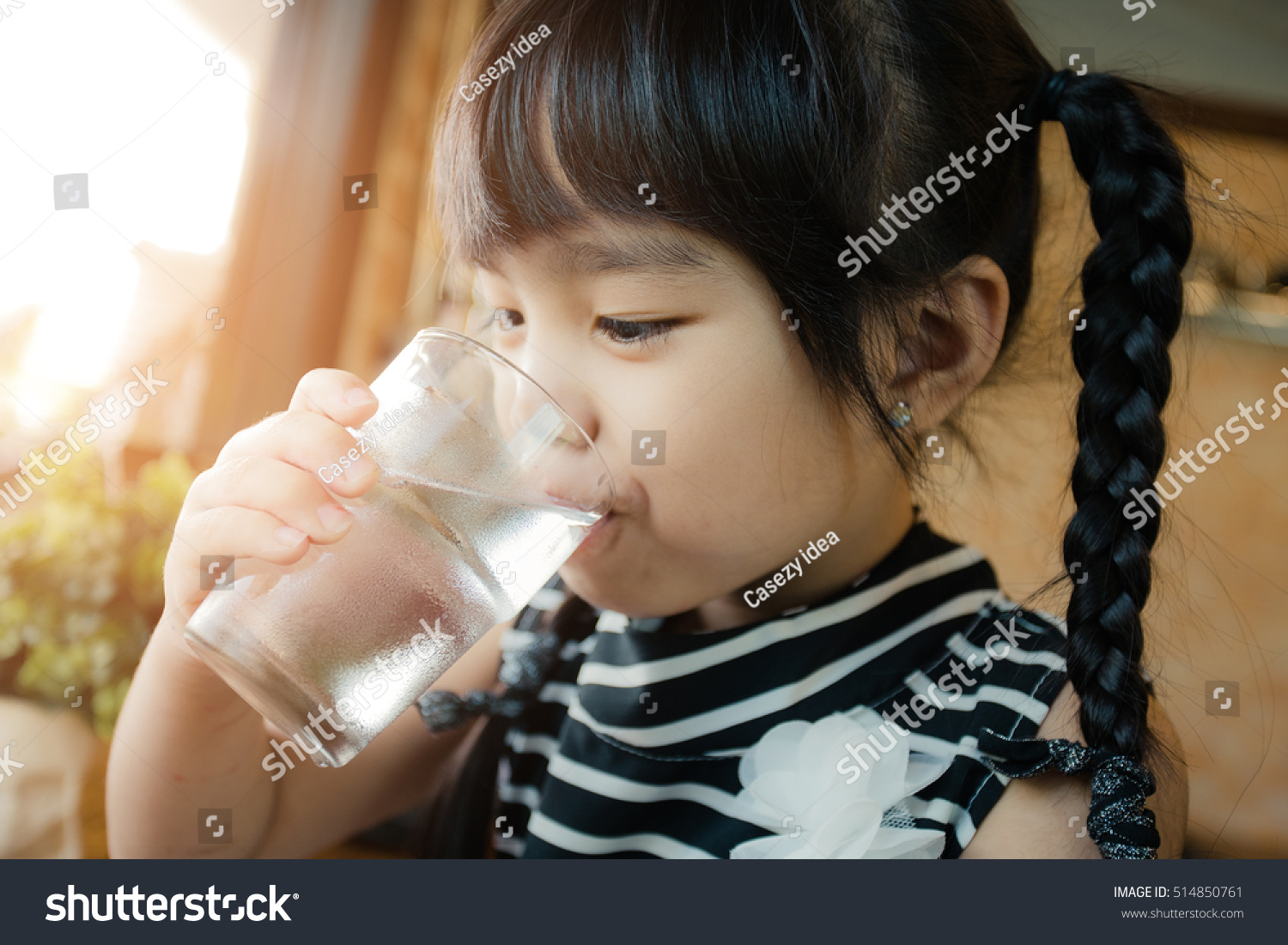 Little girl drinking water