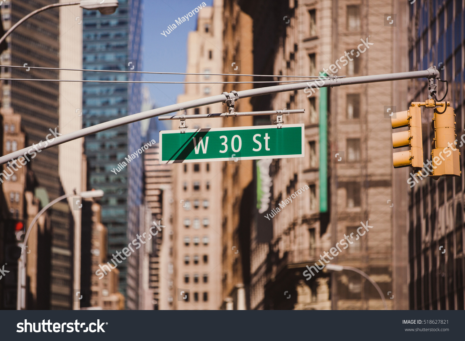Street sign on W 30 St in New York City - Urban concept in Midtown Manhattan.