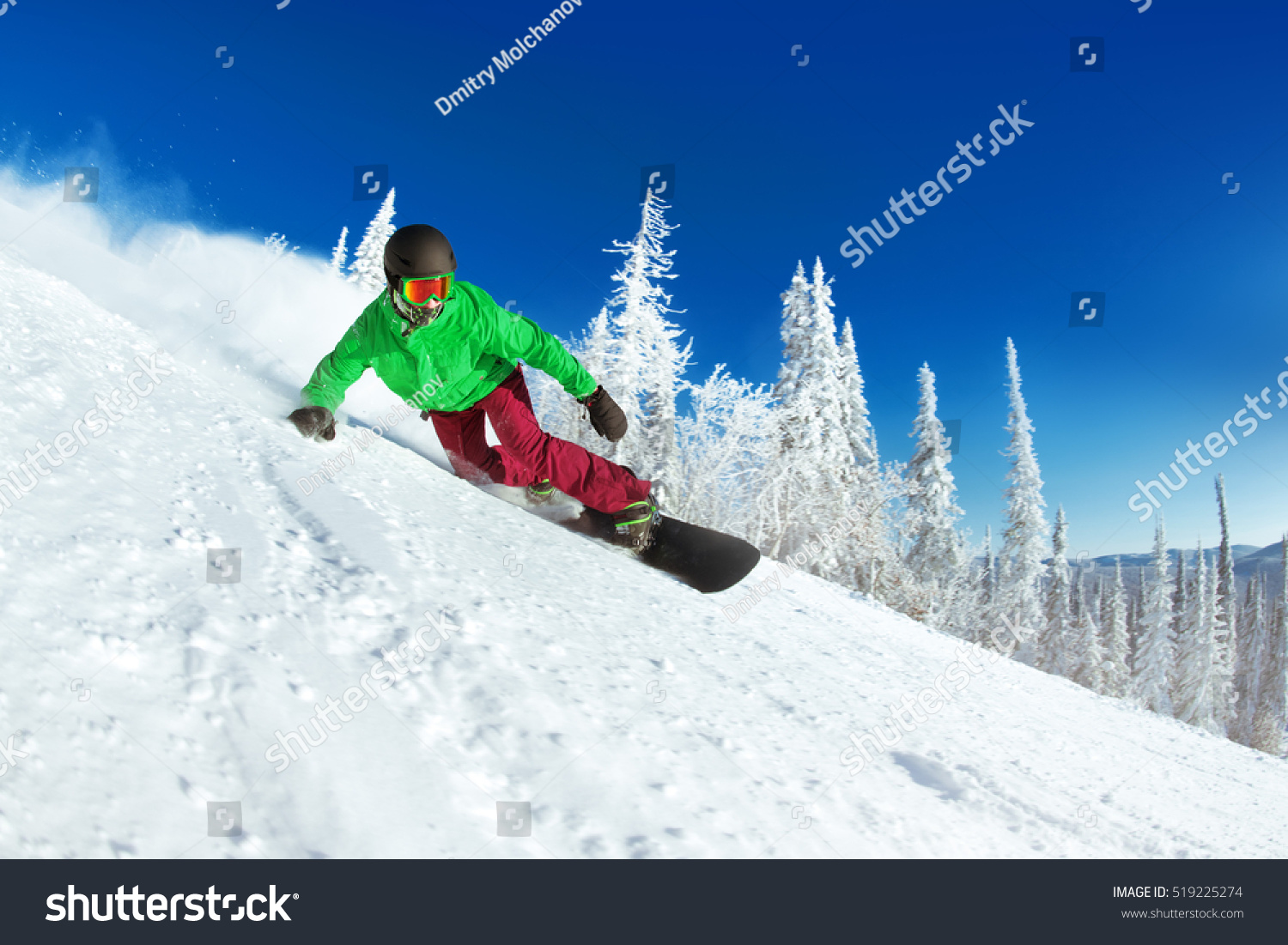 Active man snowboarder riding on slope. Snowboarding closeup. Sheregesh ski resort