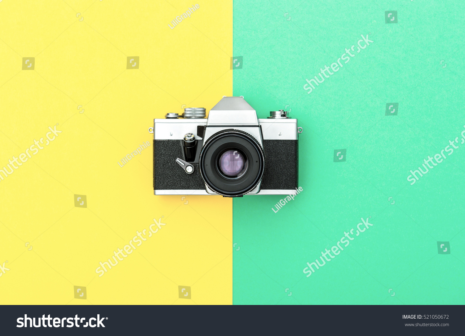 Vintage camera on color background. Retro style toned picture. Minimalistic concept