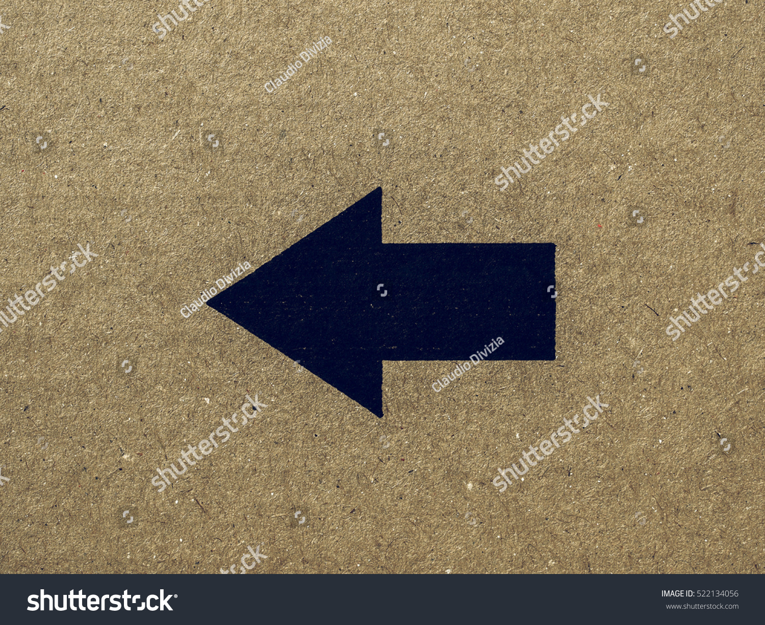 Vintage looking Black arrow on brown corrugated cardboard left ...