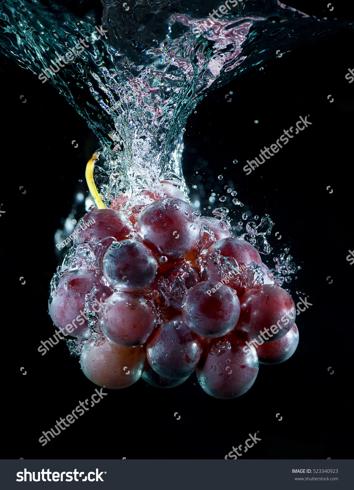 fresh grape in water with air bubbles