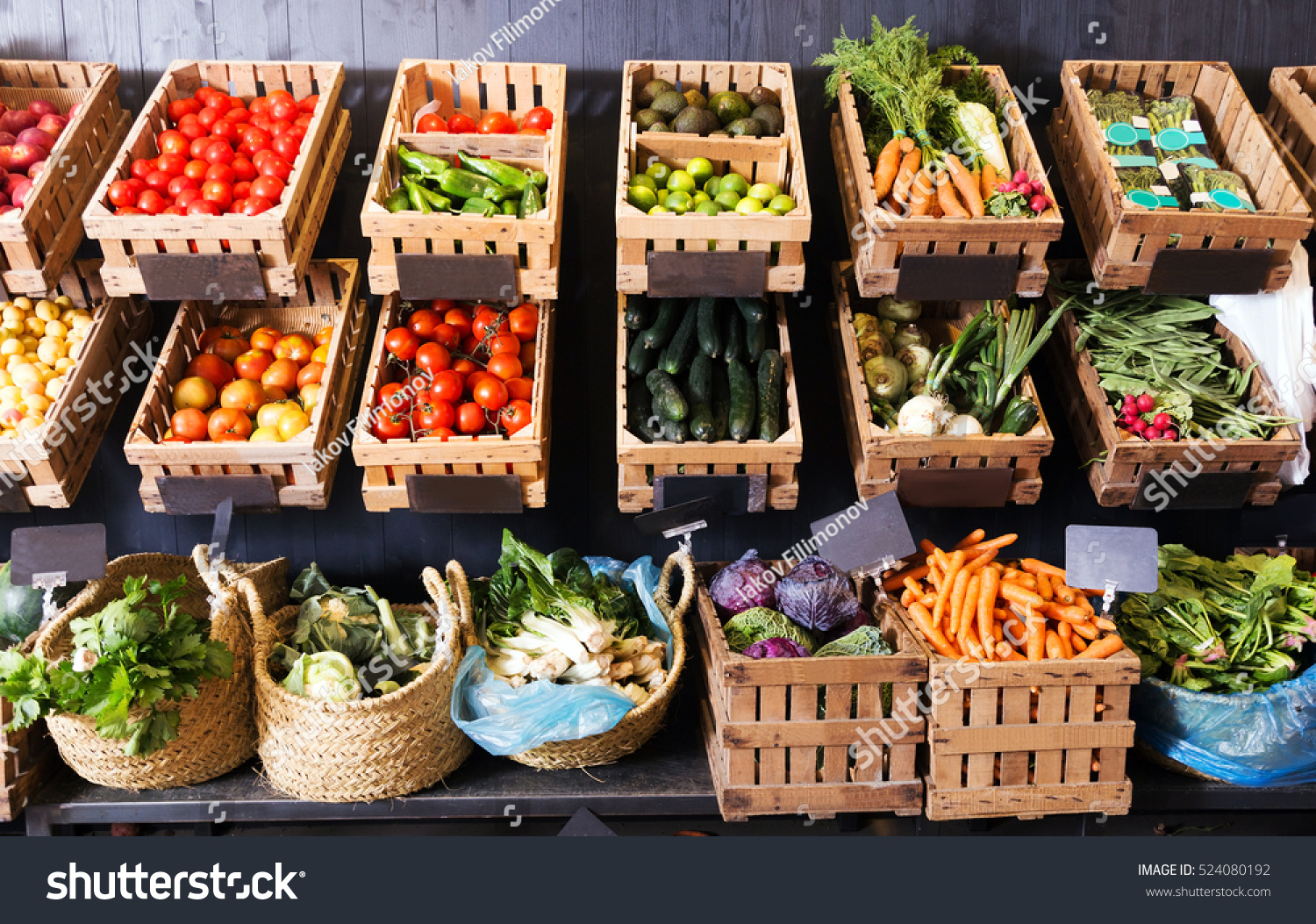 view on rustic containers with various fresh vegetables and fruits in supermarket