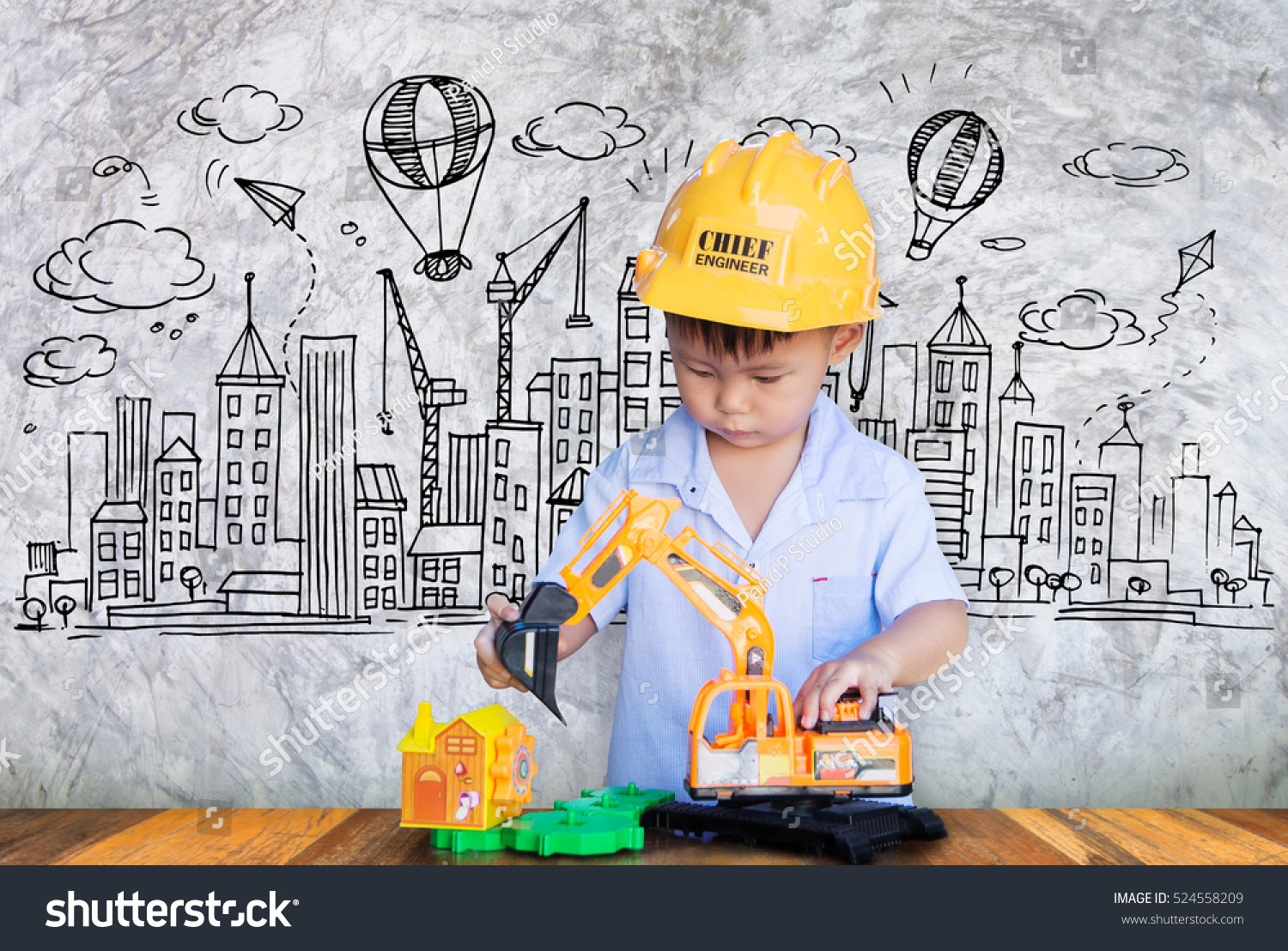 Little engineer plays with toy Concept of a small creative engineer.