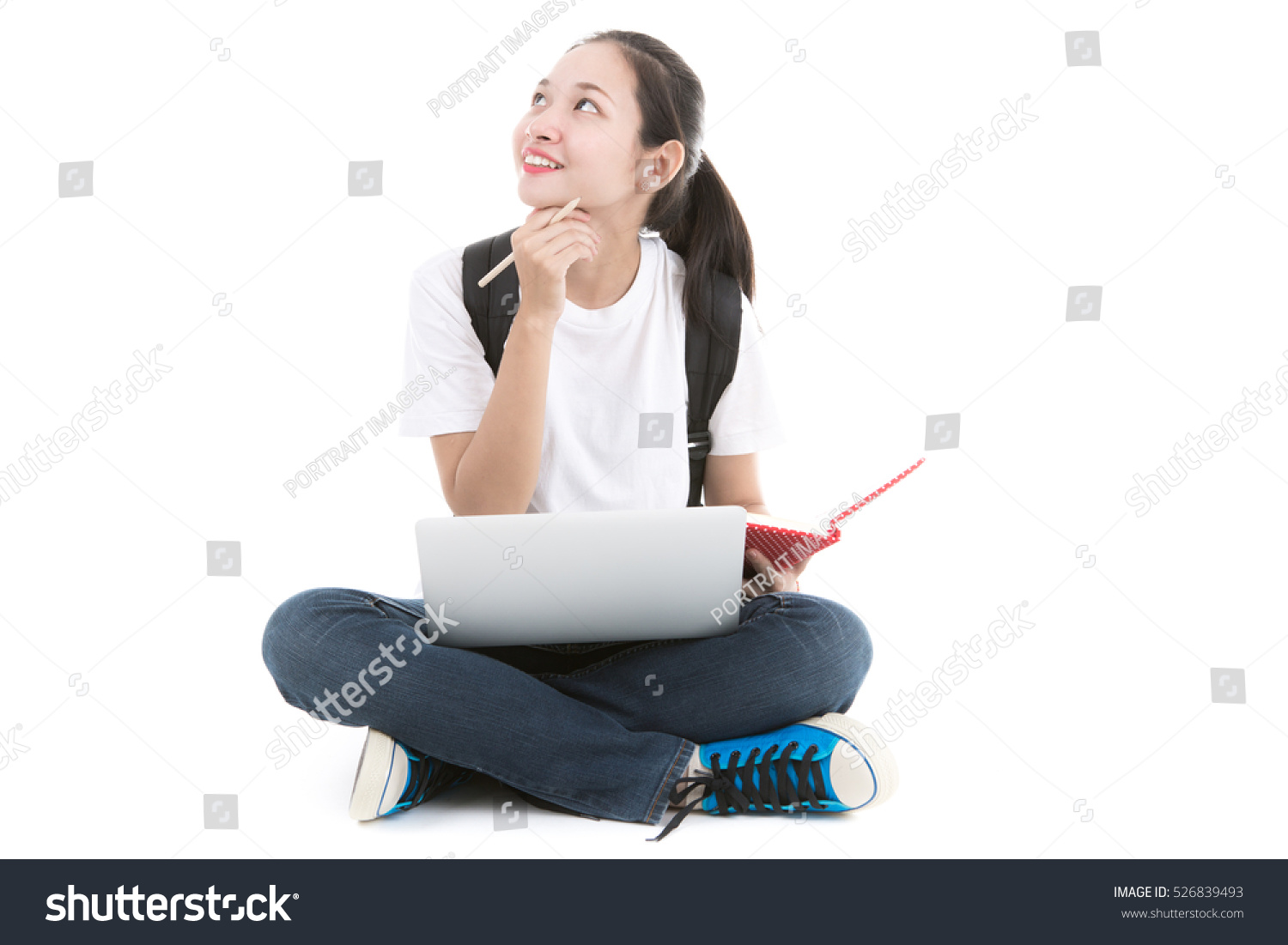 Woman student sitting with laptop isolated on white background.