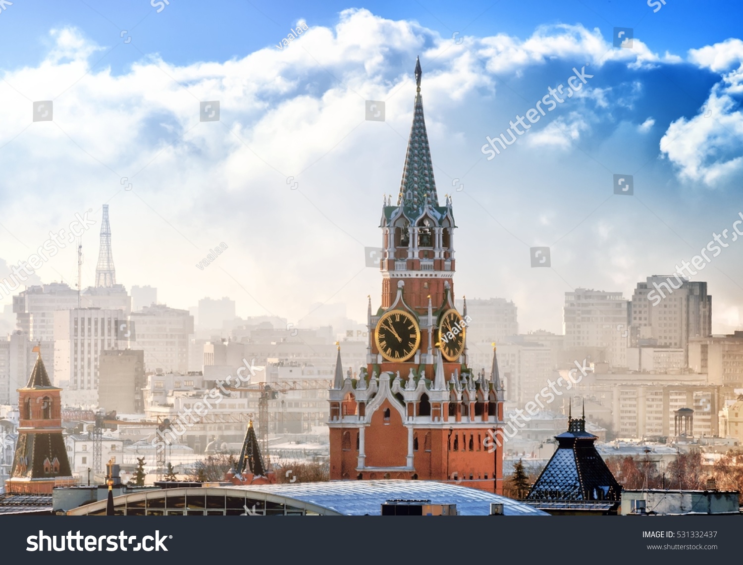 Moscow city historical skyline winter aerial view snow building street kremlin spasskya tower red square smoke church residential building roof russian winter theme close up