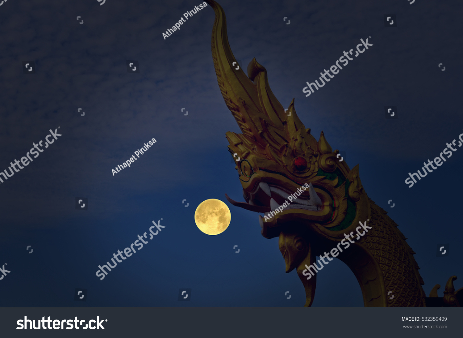 Beautiful naga head sculpture and full moon night