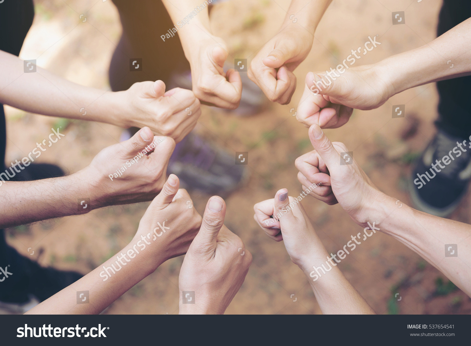 Team Work Concept : Group of Diverse Hands Together Thump up of young people in the nature.