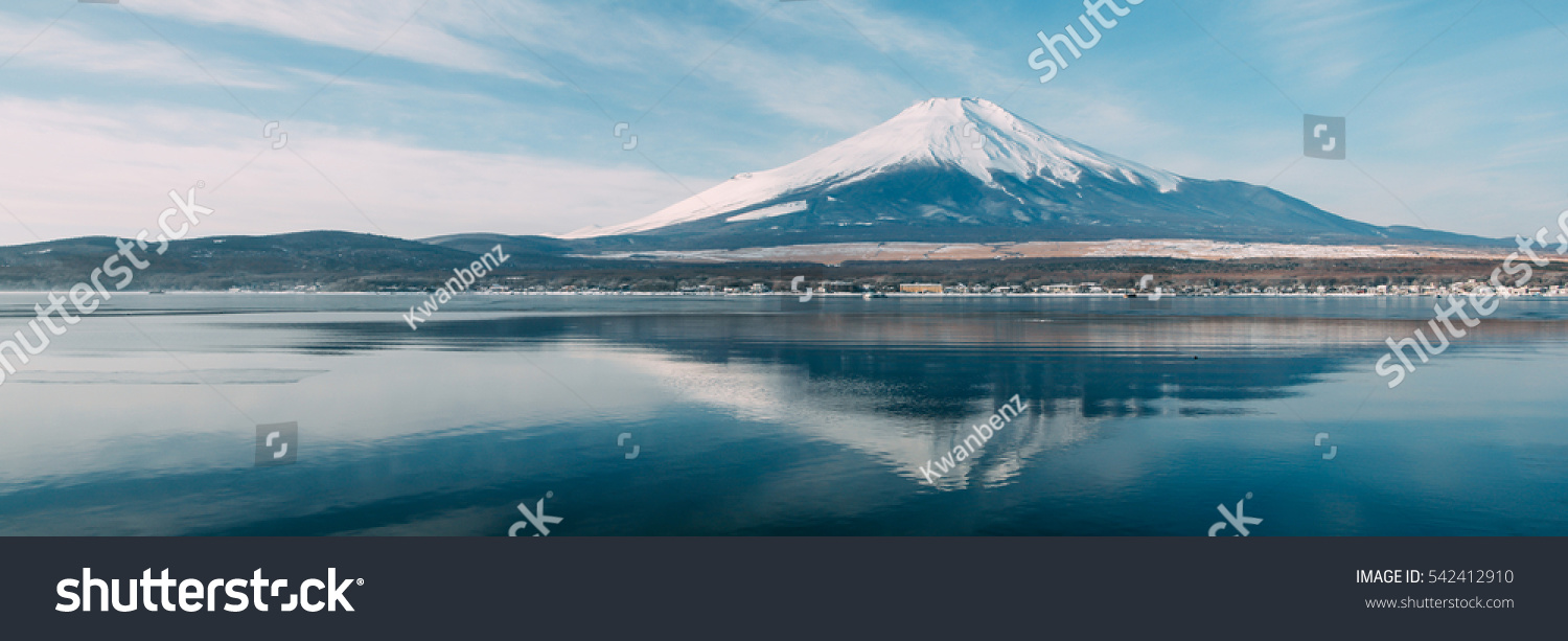 The sacred mountain of Fuji in the background of blue sky at Japan