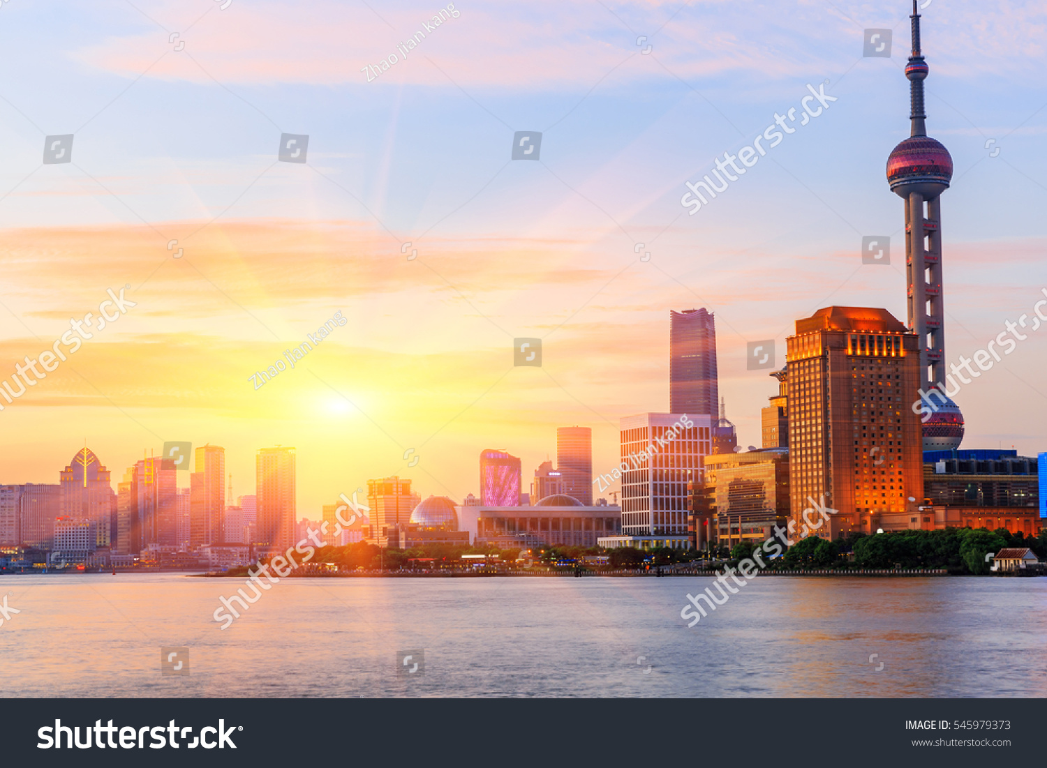 Shanghai skyline on the Huangpu River at sunset China