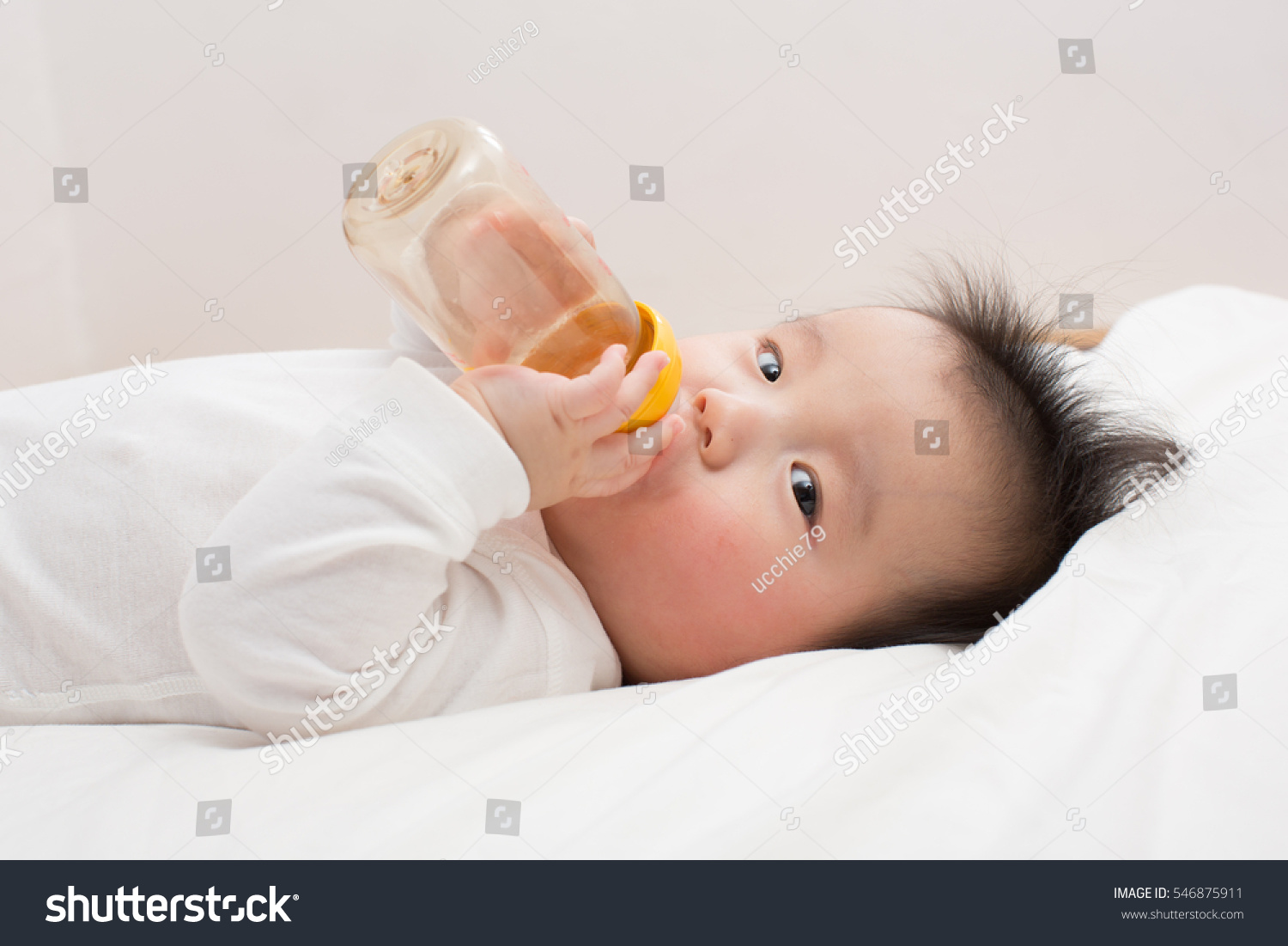 asian baby drinking milk
