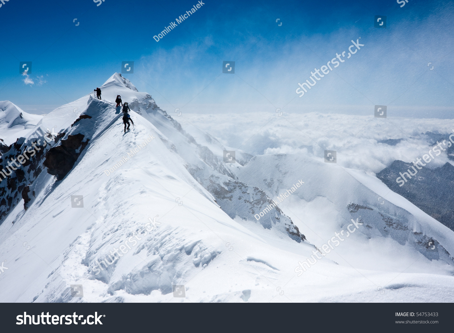 Climbers balancing in blizzard on a narrow ridge of Lyskamm (aka Maneater  4480 m)