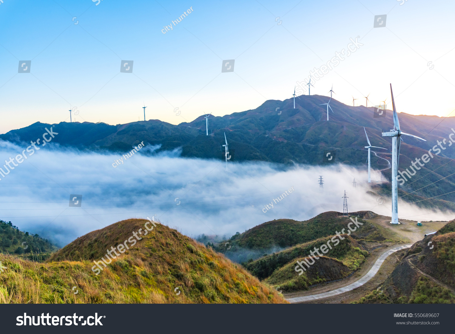 Wind power generator before sunrise sunset