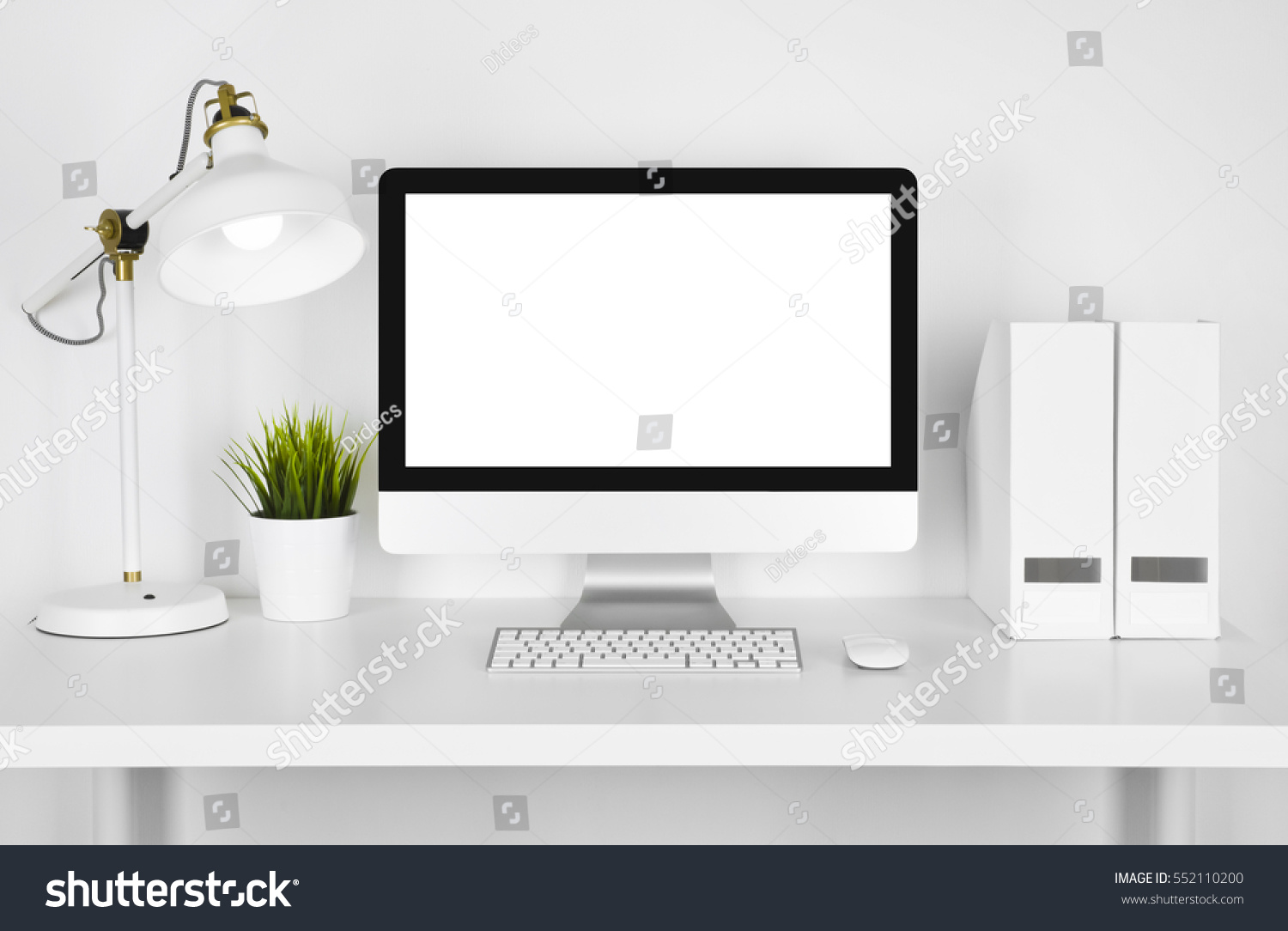 Blank screen computer  lamp and table folder over white background