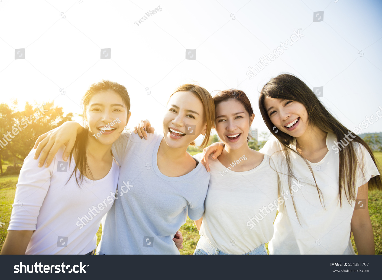 Group of young beautiful women smiling