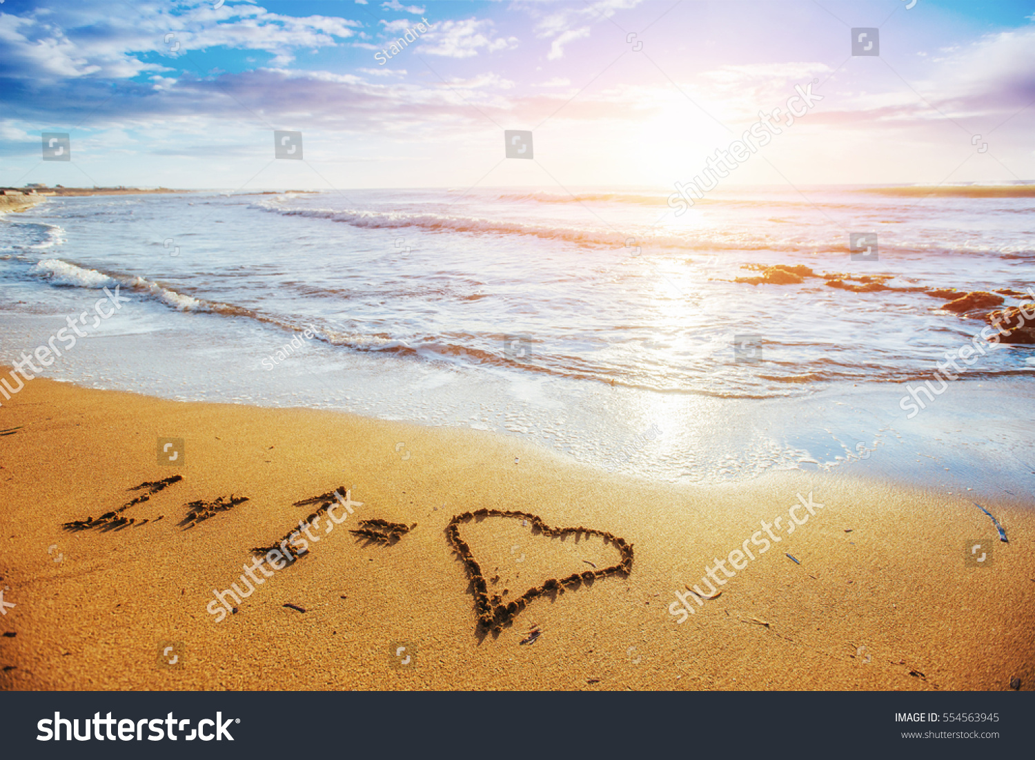 Child picture drawn in the sand on the atlantic coast