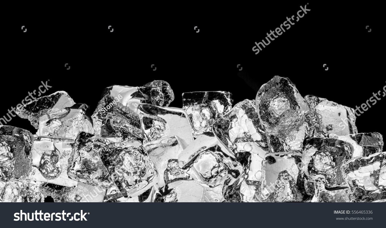 Pieces of crushed ice cubes on black background.