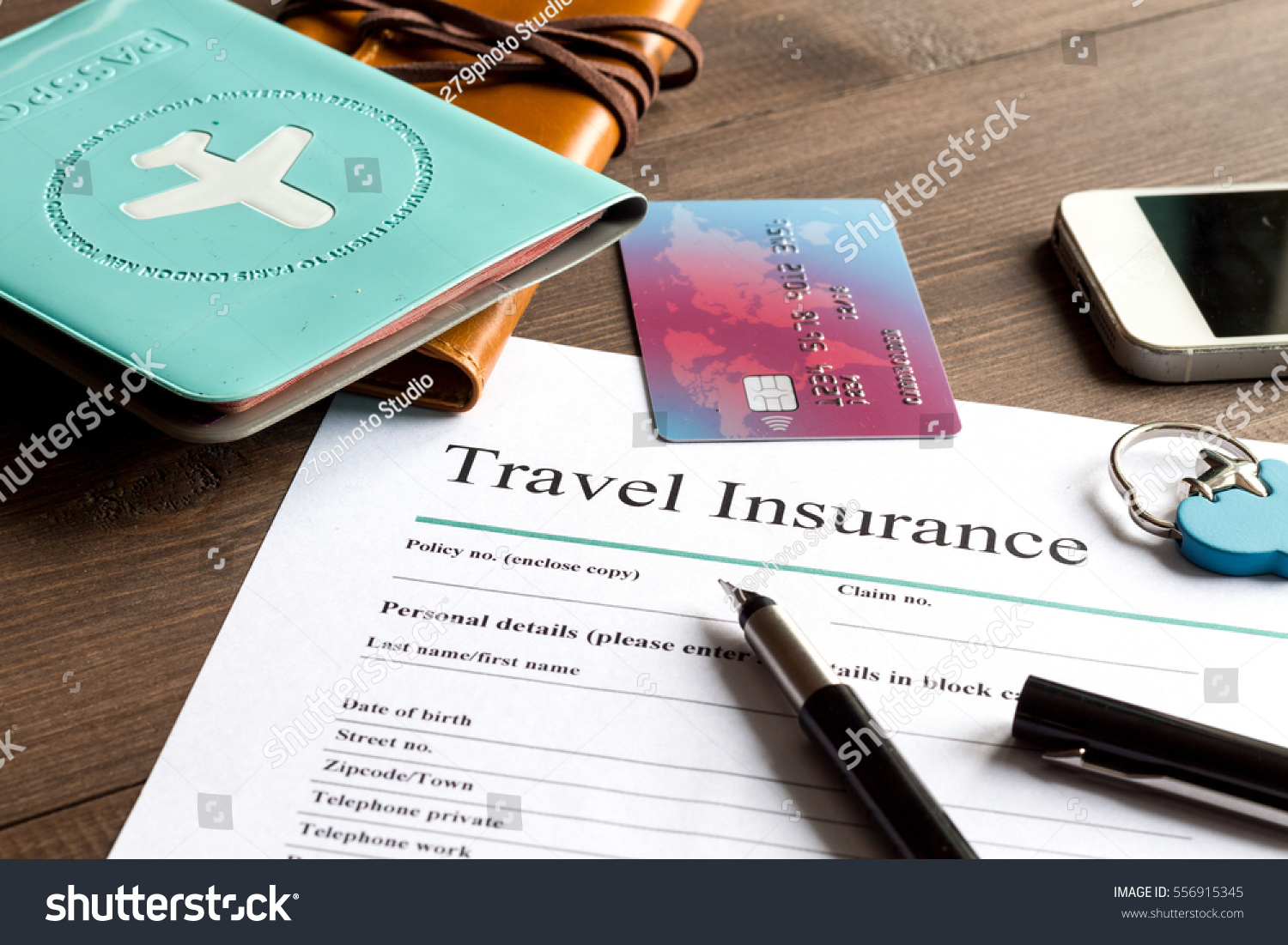 concept booking travel insurance on wooden background
