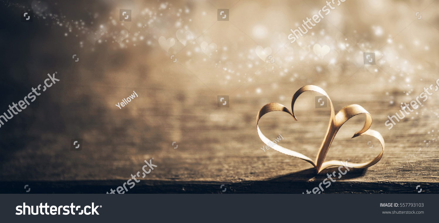 Two ribbon magic hearts on wooden backround  Valentine day concept