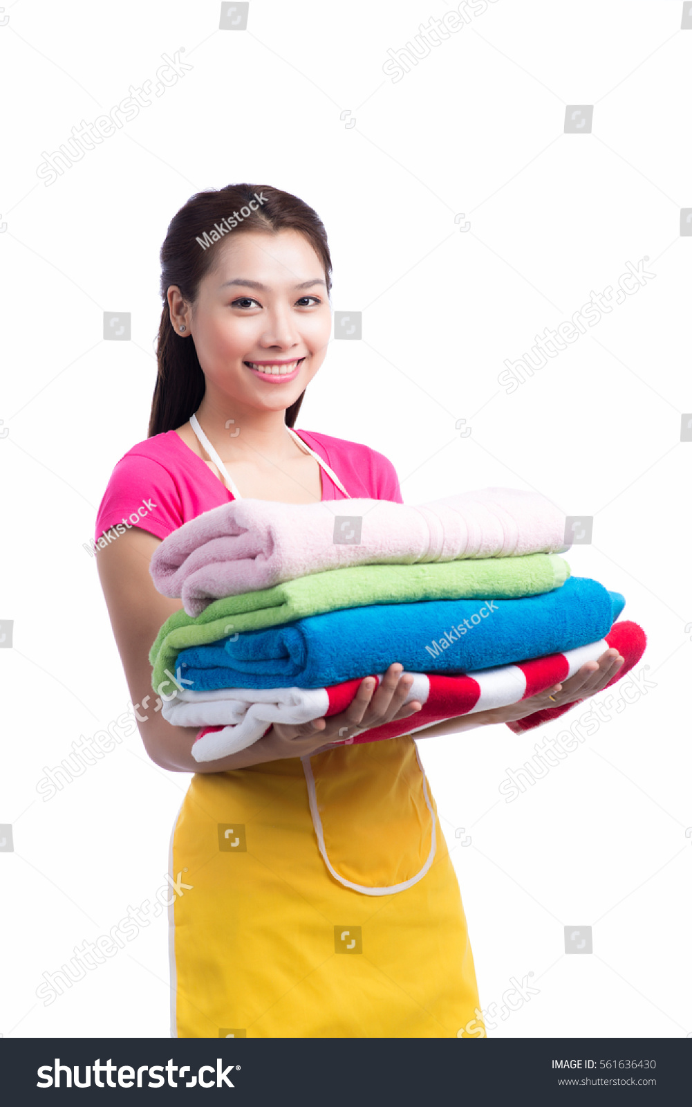 A portrait of a young asian woman holding clothes