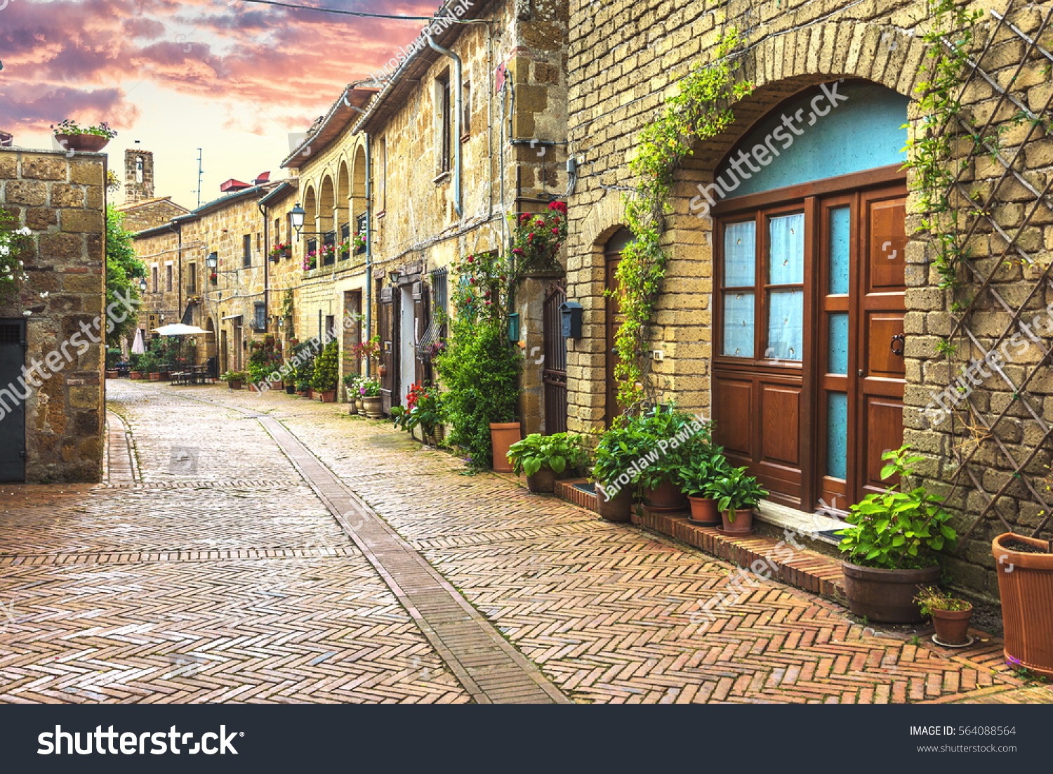 Flower filled streets of the old Italian city in Tuscany.