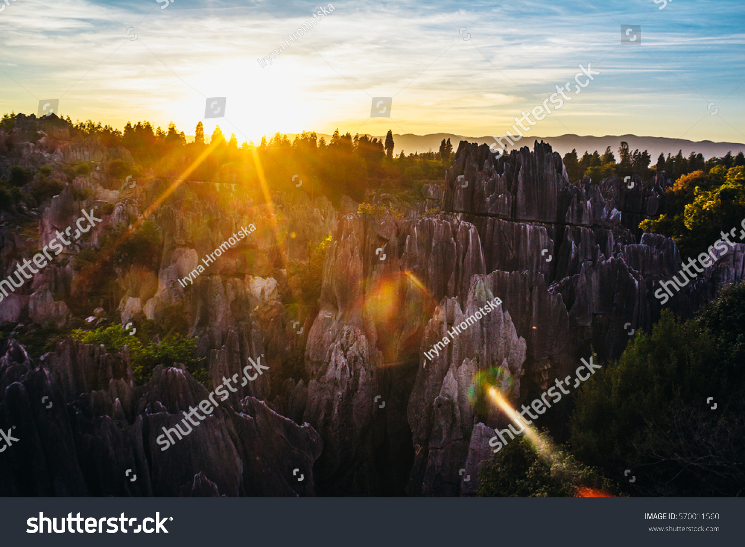 Colorful sunset in Stone Forest in Shilin  Yunnan Province  South China  not far from the  Kunming. It is the world-famous natural area of limestone formations and UNESCO World Heritage Site.