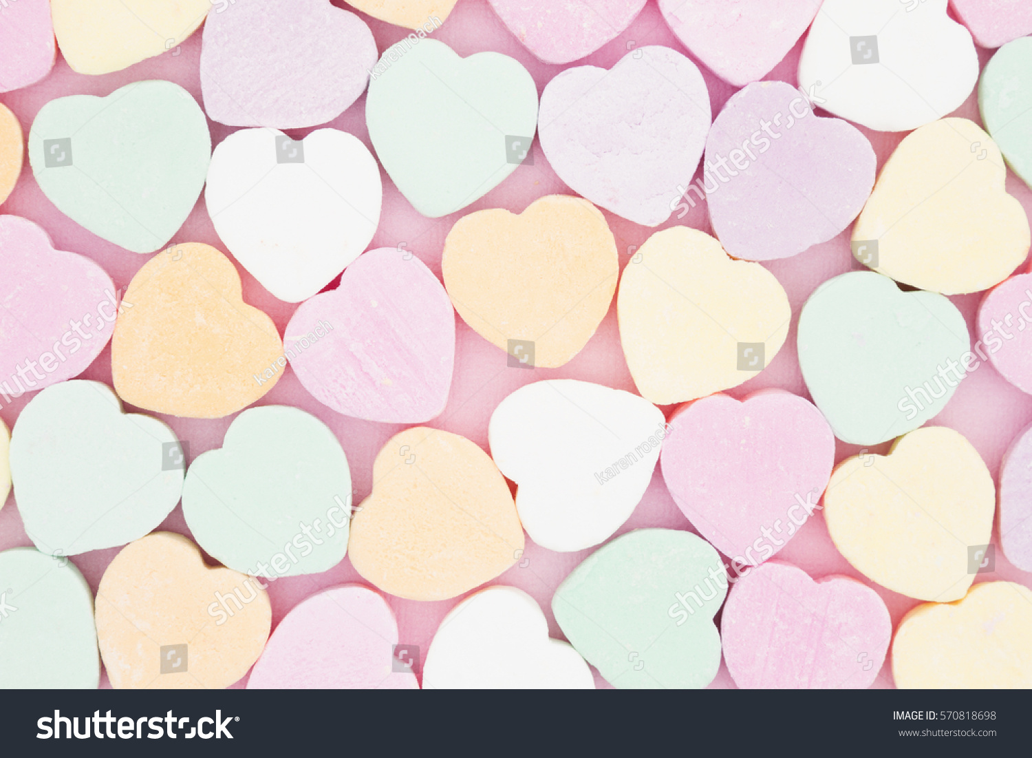 Old fashion pale multi colored candy heart background
