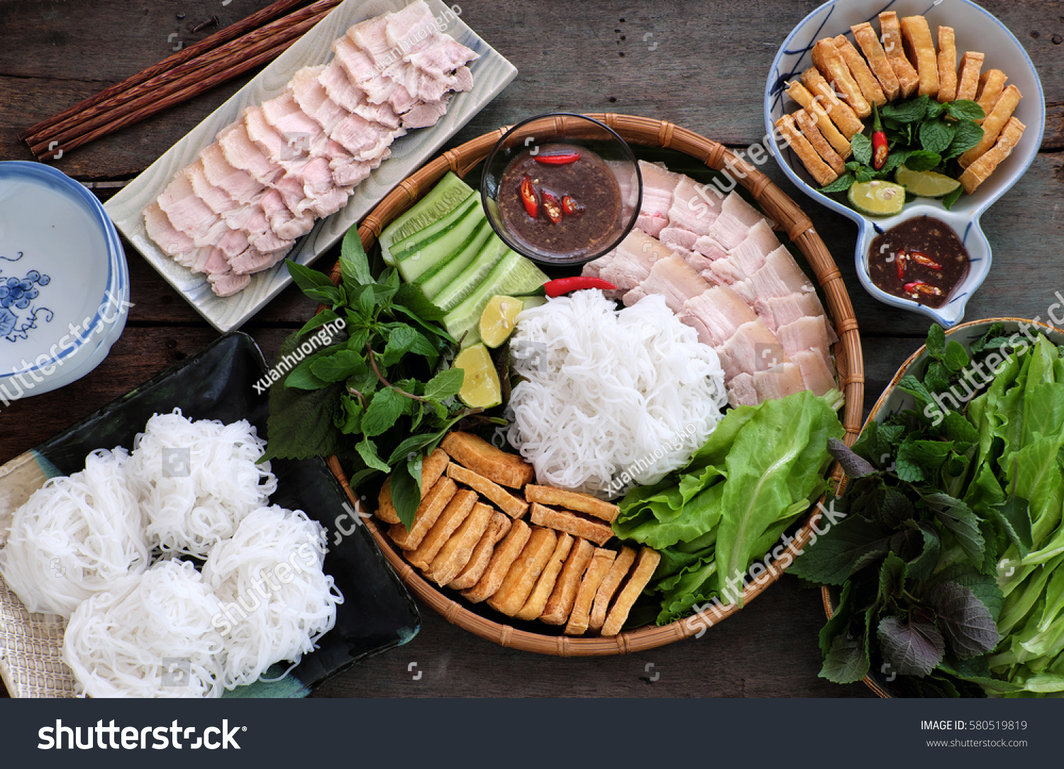 Delicious Vietnamese food  bun dau mam tom  is popular street food make from vermicelli with boiled meat  fried tofu  shrimp paste and green vegetables  cucumer and spice as chilli  lemon 