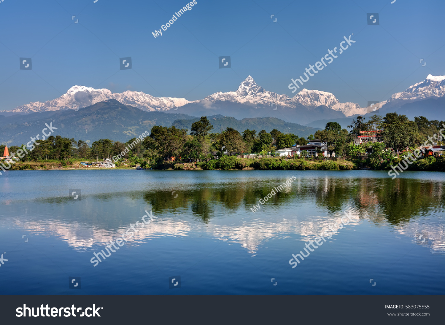 View at Annapurna mountain range and its reflection in Phewa lake in Pokhara  Nepal