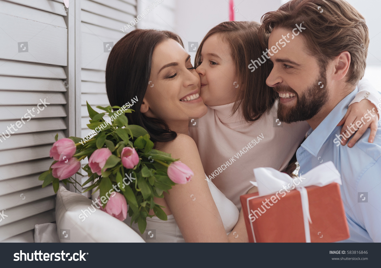 Nice pleasant girl kissing her mother