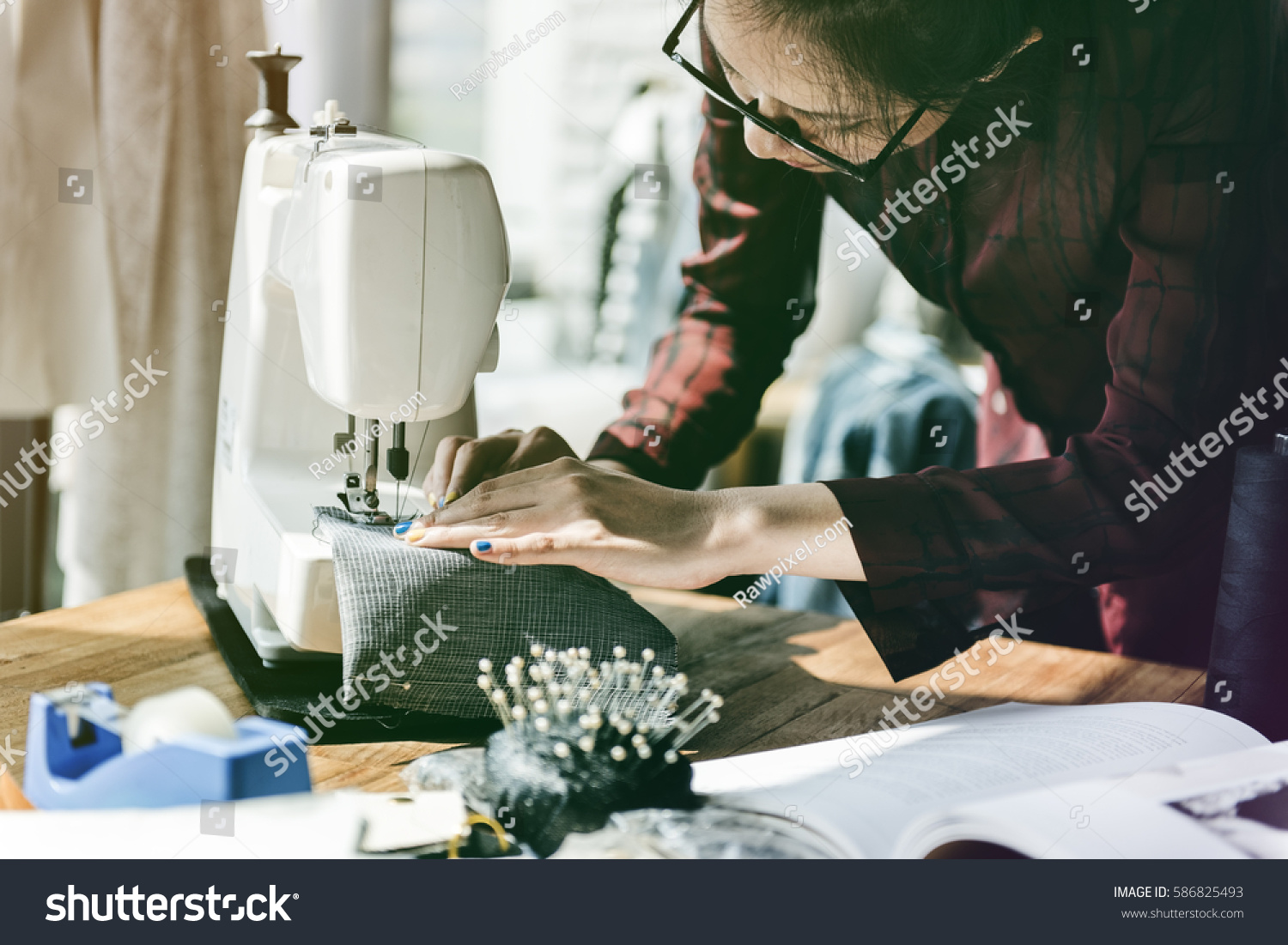 Fashion designer tailor made with sewing machine