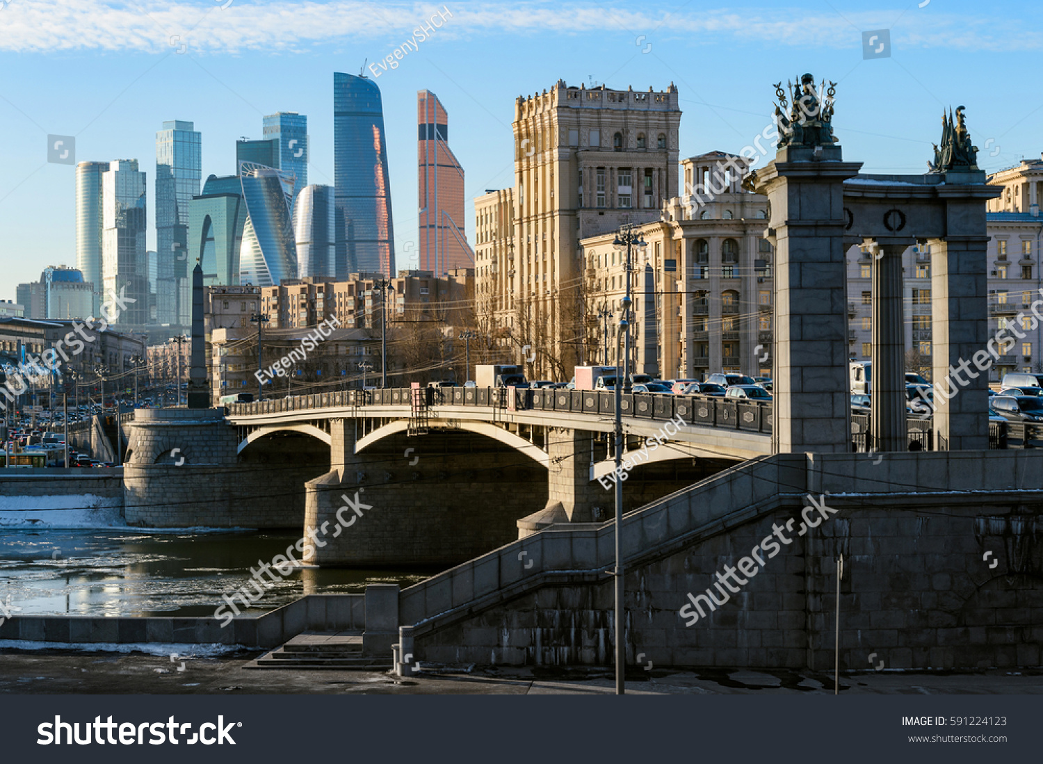 Landscape of modern Moscow city skyscrapers and ancient city architecture. Fantastic view of Borodinsky bridge on river Moscow old buildings and high towers of Russia capital downtown. Moscow Russia
