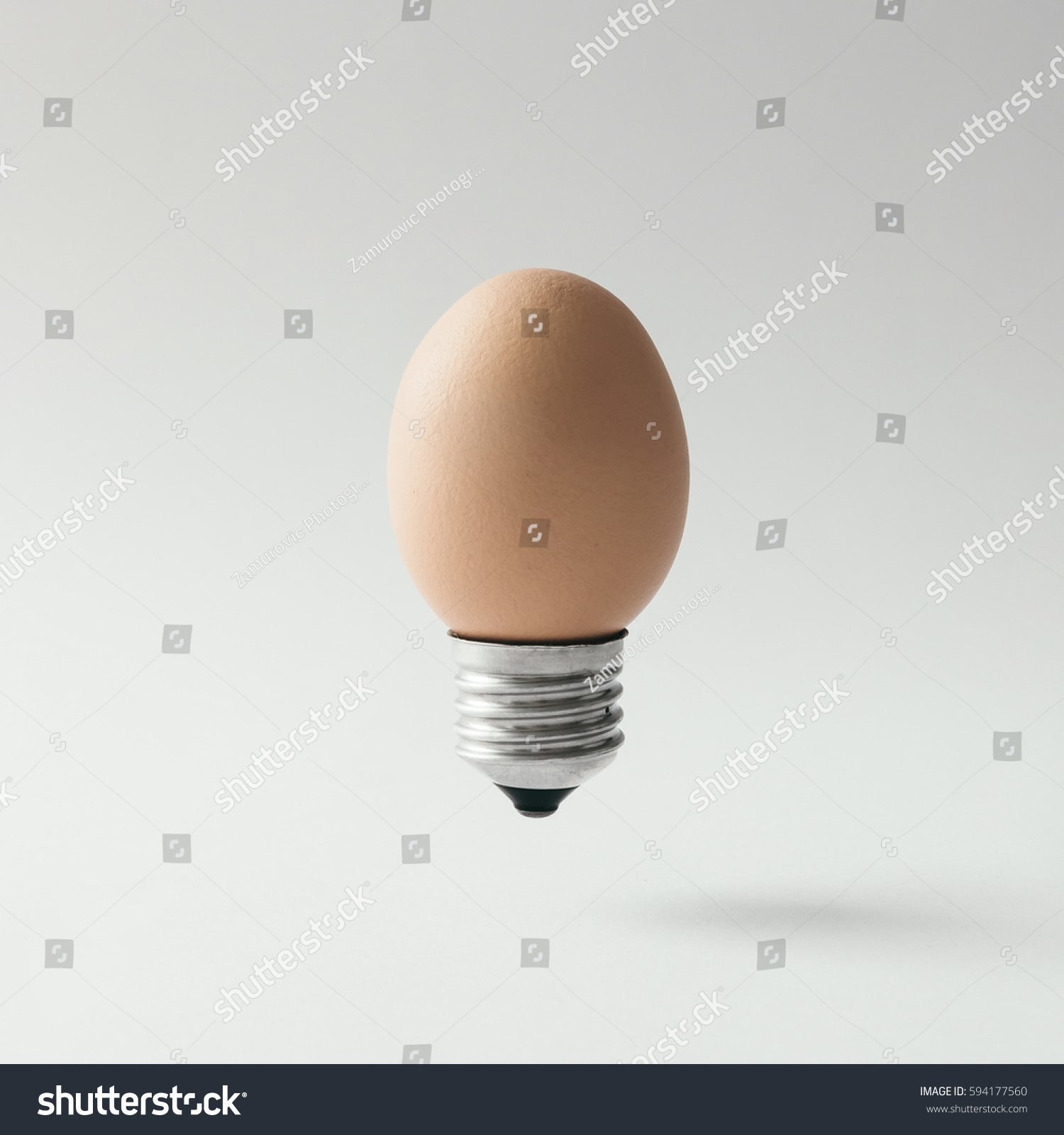 Egg lightbulb on bright background. Idea concept.