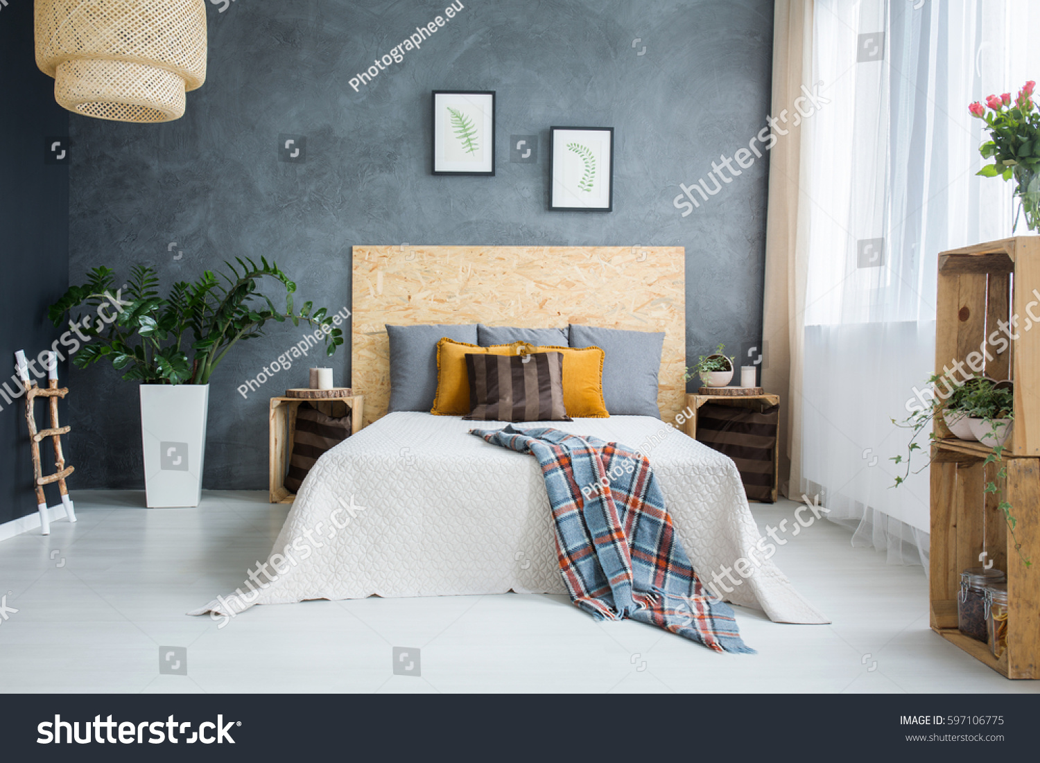 Bedroom with concrete wall  bed  lamp and plants