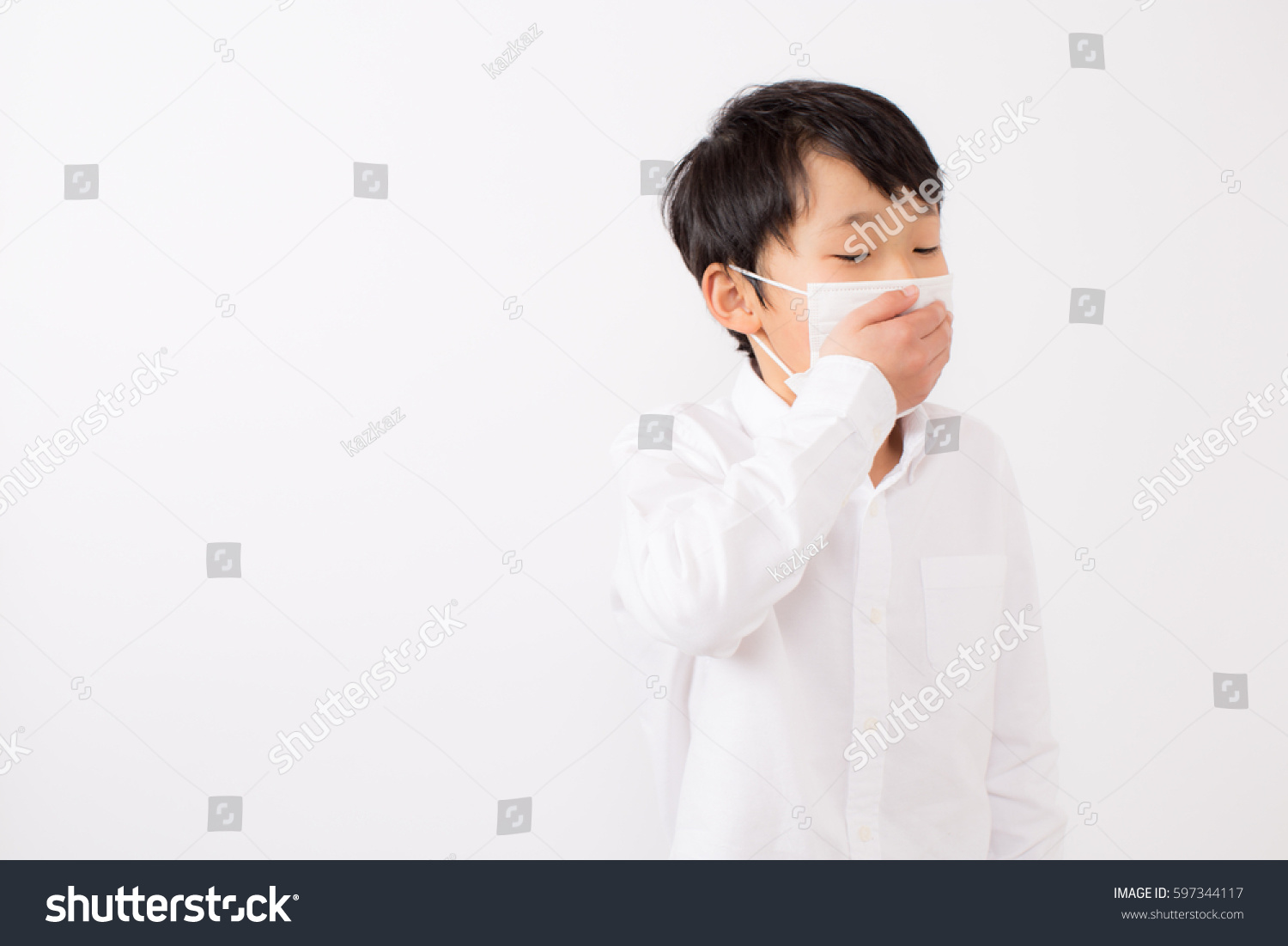 Boy who caught a cold. he is wearing a mask