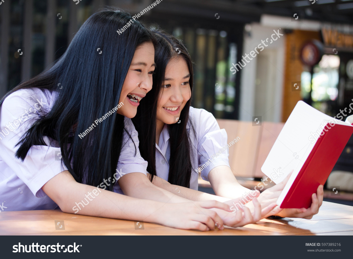 two asia thai high school student uniform Best friends beautiful girl reading book