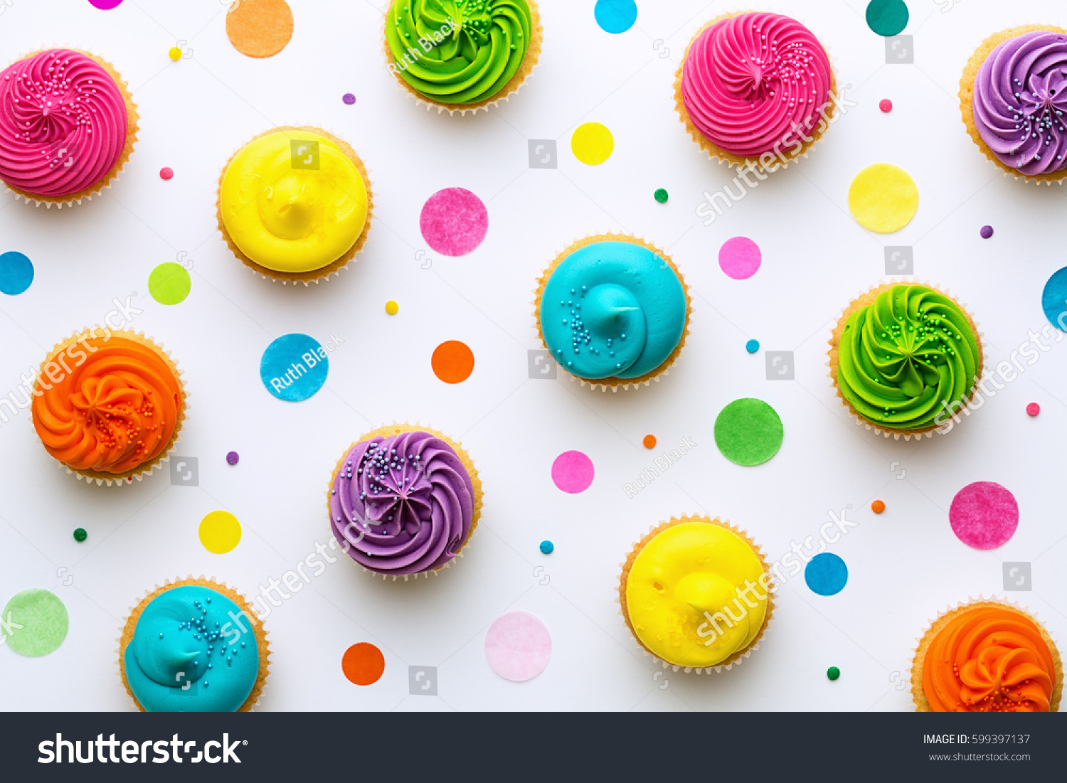 Colorful cupcakes on a white background
