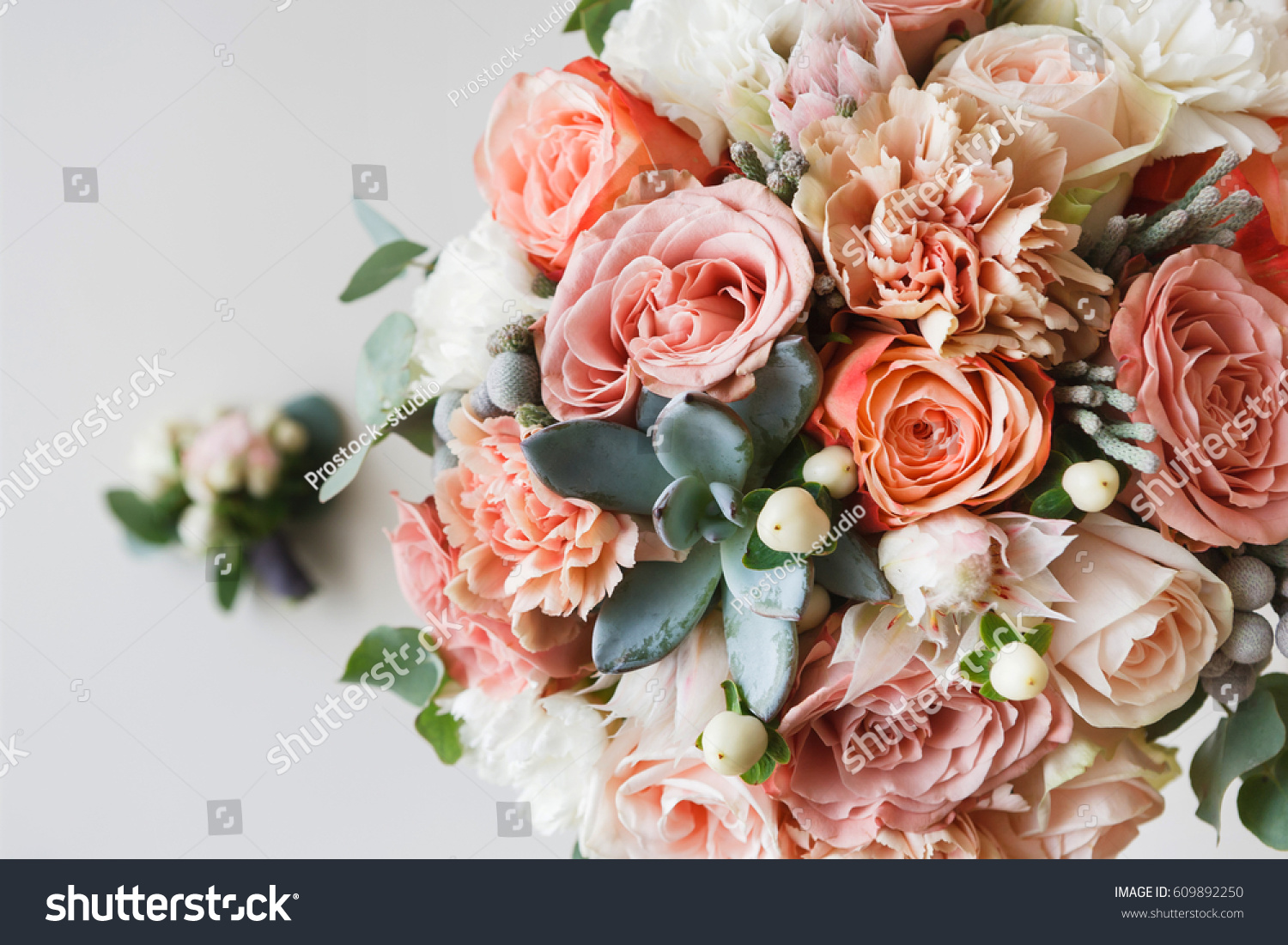 Wedding flowers bridal bouquet closeup. Decoration made of roses peonies and decorative plants close-up selective focus nobody objects