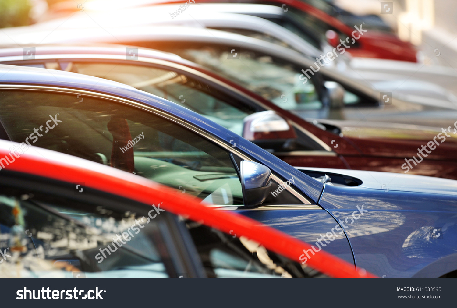 Group of cars parked in a row 