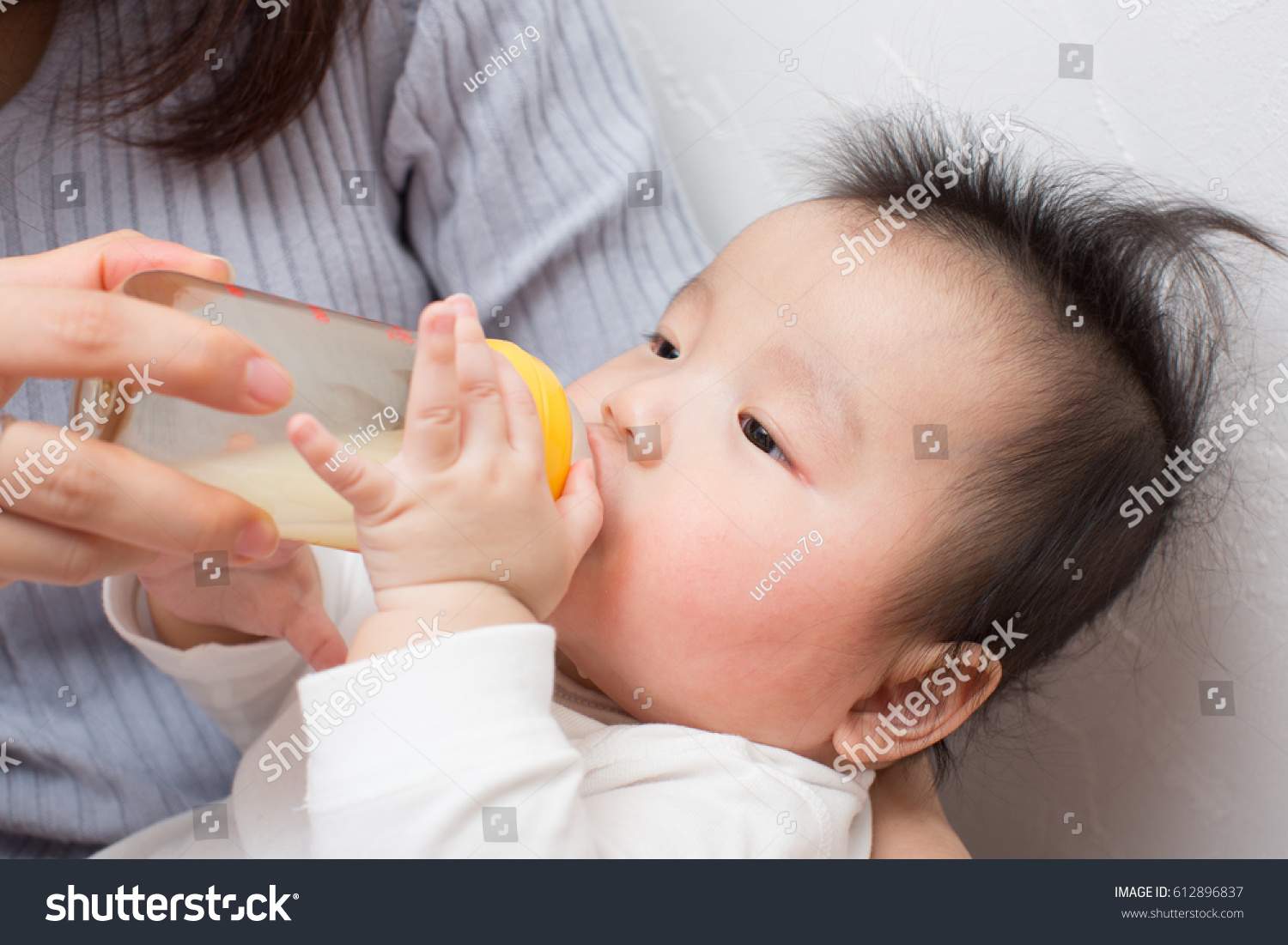 asian baby drinking