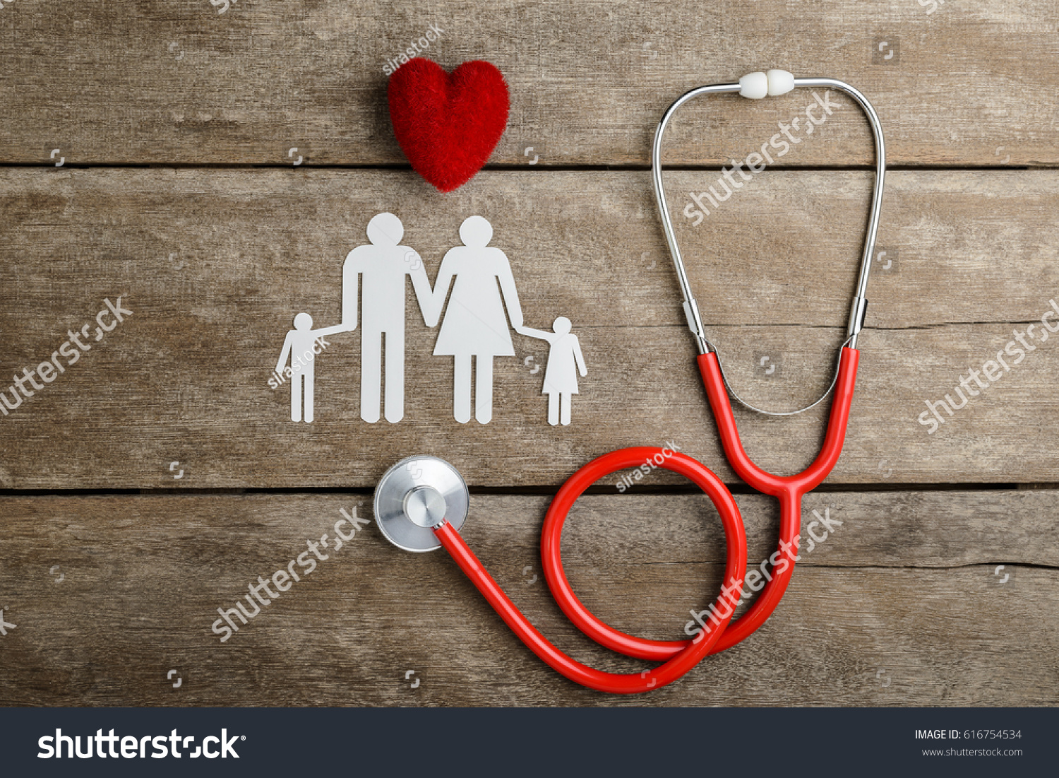 Red heart  stethoscope and paper chain family on wooden table  Health Insurance Concepts