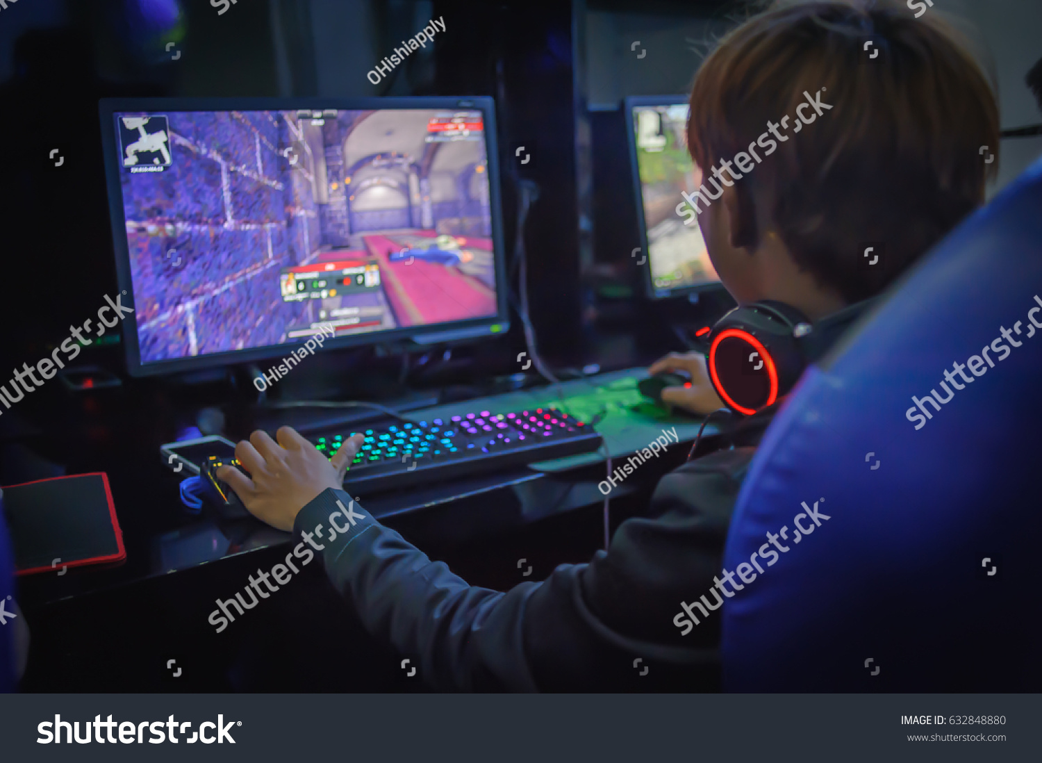 young man playing computer games on line