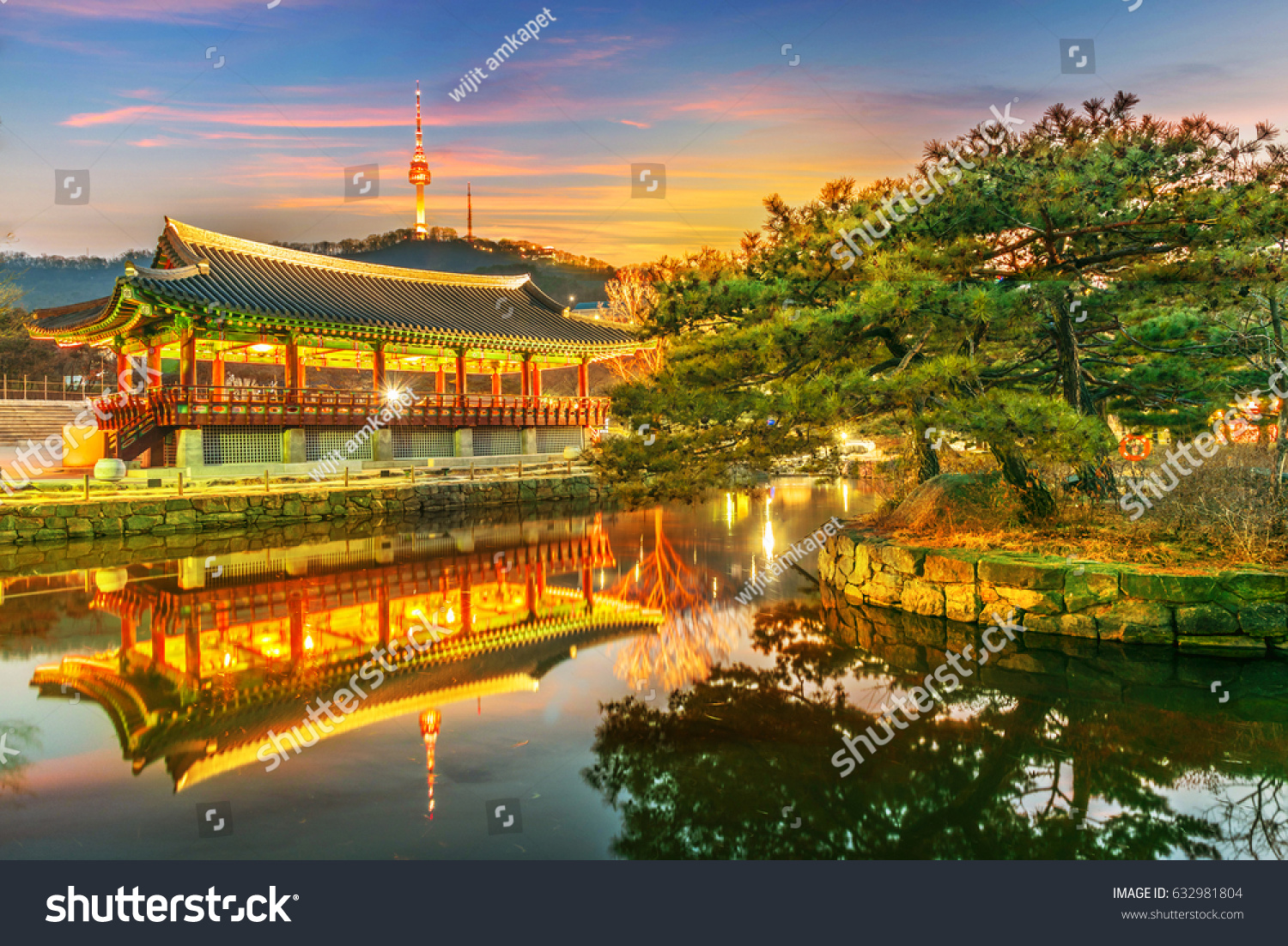 Namsangol Hannok Village and Seoul Tower Located on Namsan Mountain at Twilight in Seoul South Korea.