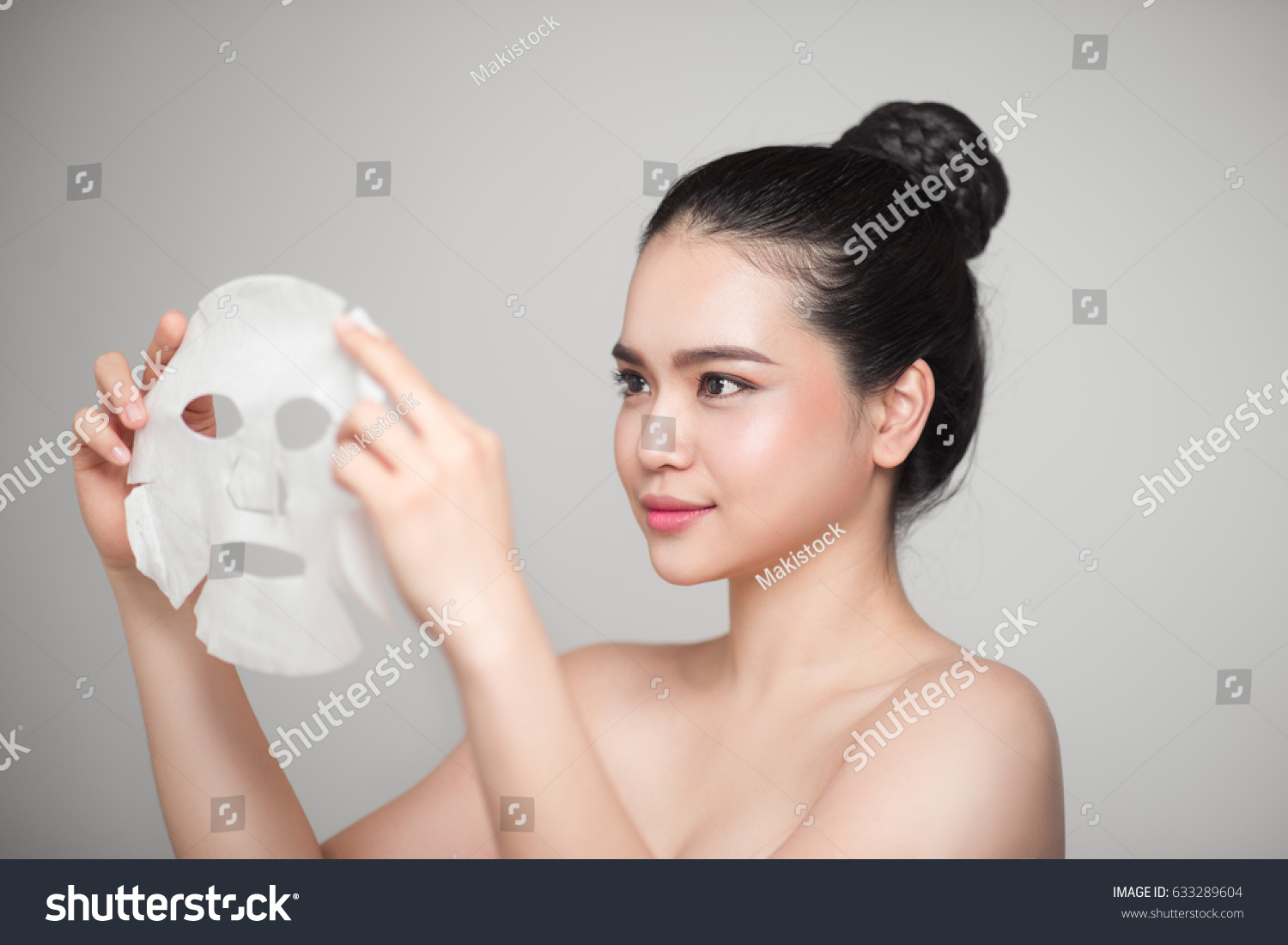 Spa  healthcare. Asian girl with a cosmetic mask.