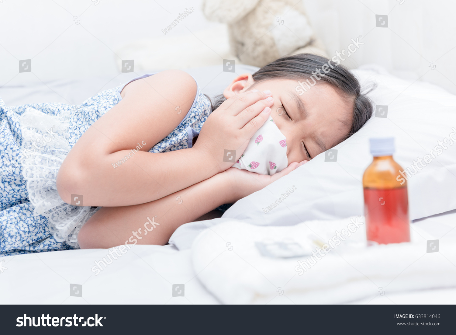 sick girl lying in bed and sore throat and cough  healthcare concept