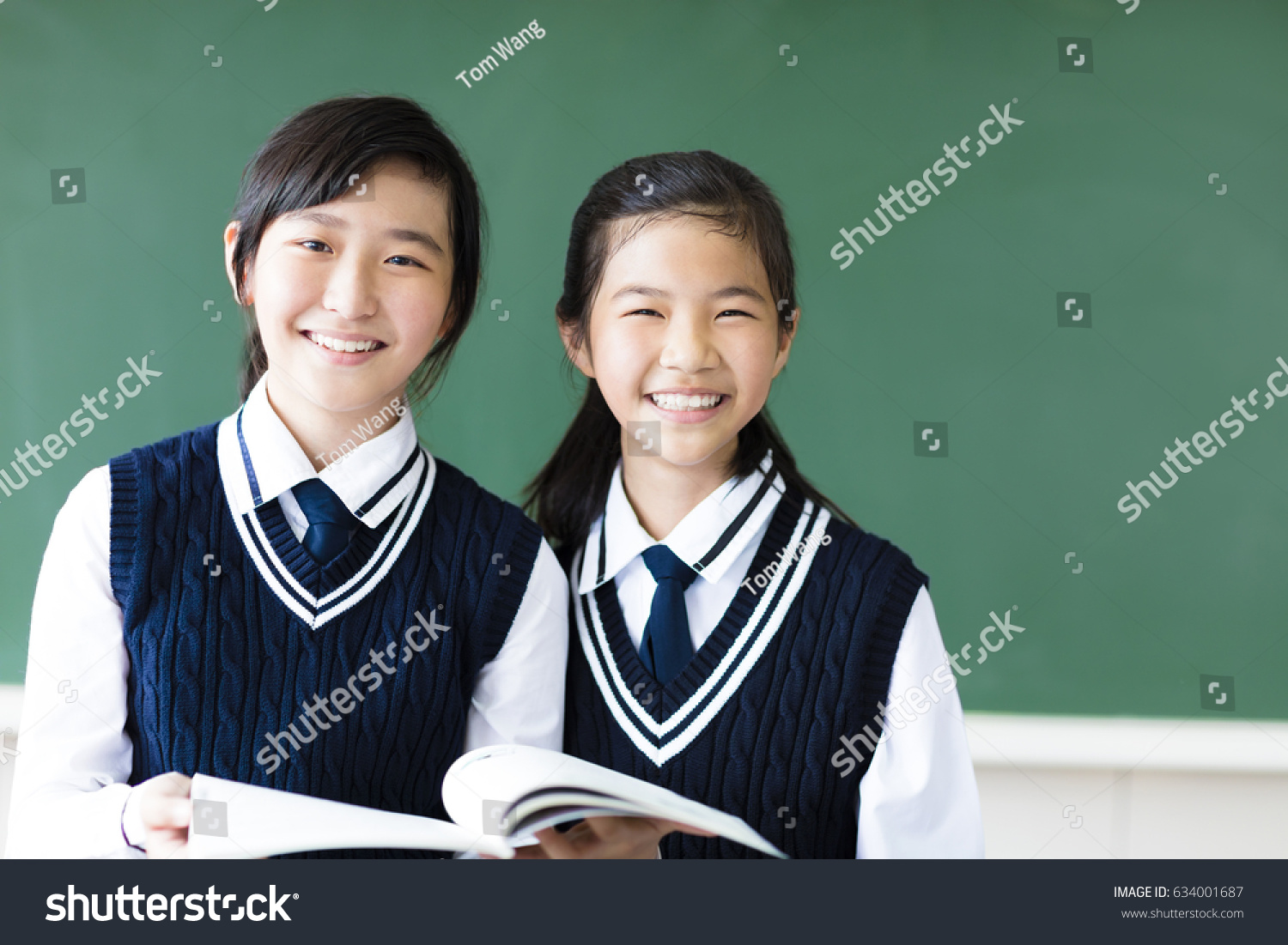 smiling  teenager student girls in  classroom
