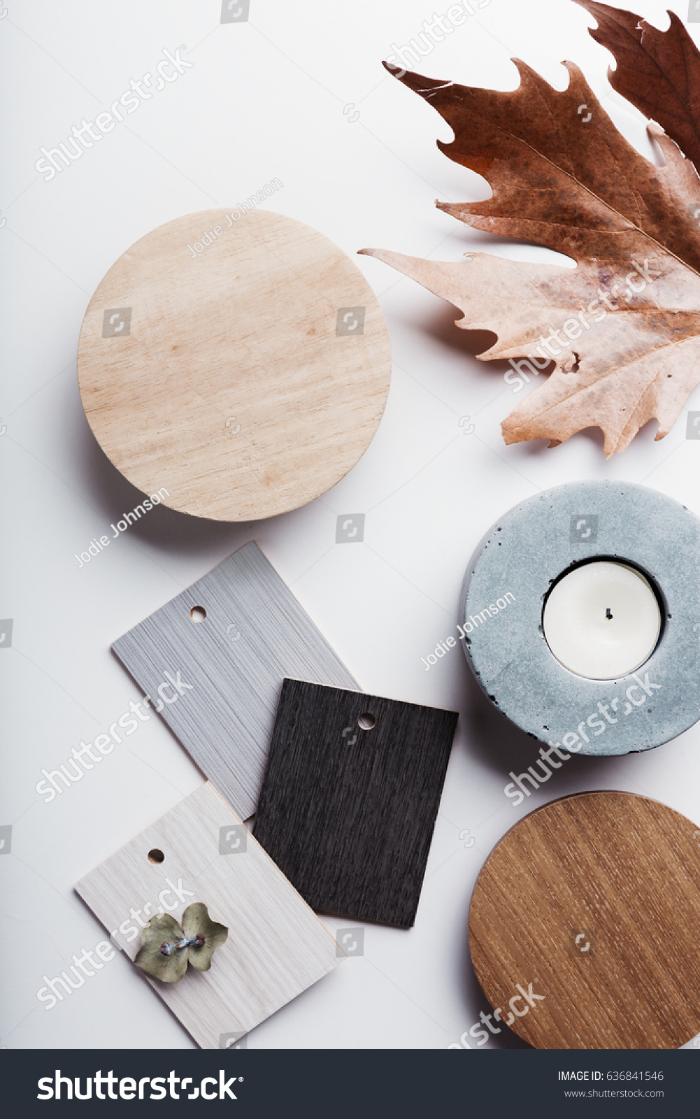 Flat lay of autumn grey and warm tone interior finishes objects
