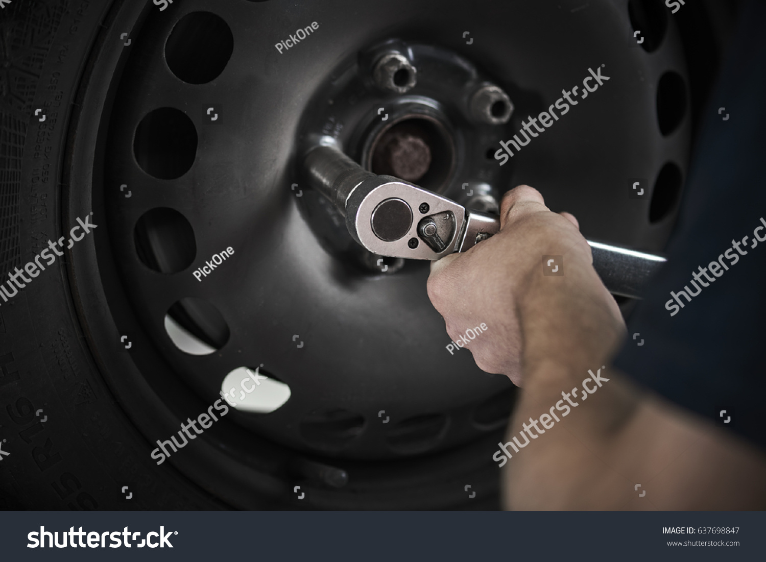 a mechanic are changing tires