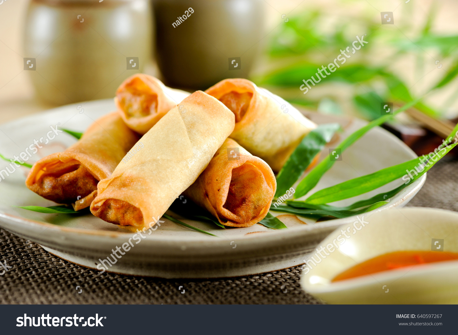Fried chinese spring rolls with sweet chili sauce.